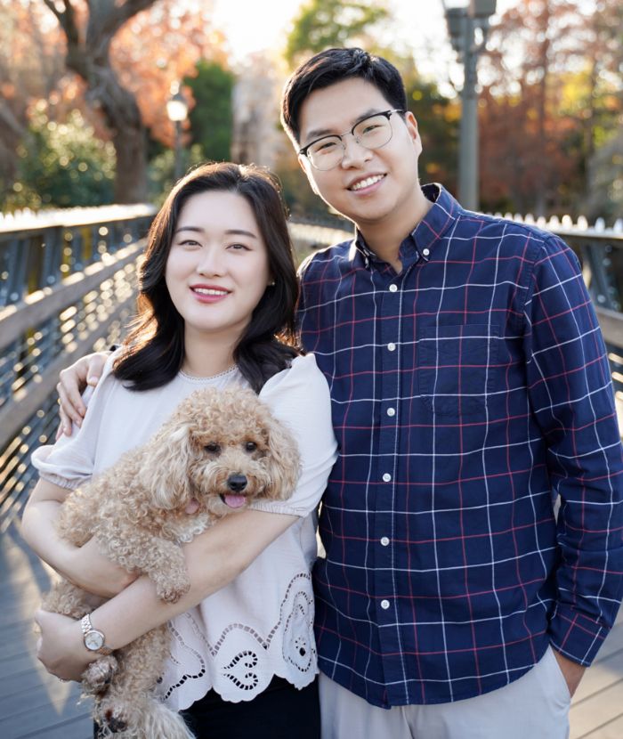 Grand Prairie dentists Doctor Anna Lee and Doctor Jonathan Min with their small fluffy dog